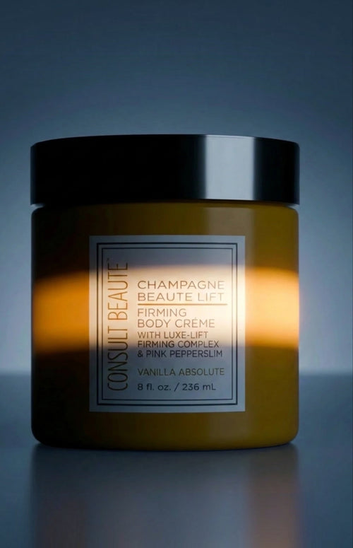 Jar of Champagne Beaute Lift body crème with a reflective label on a dark background