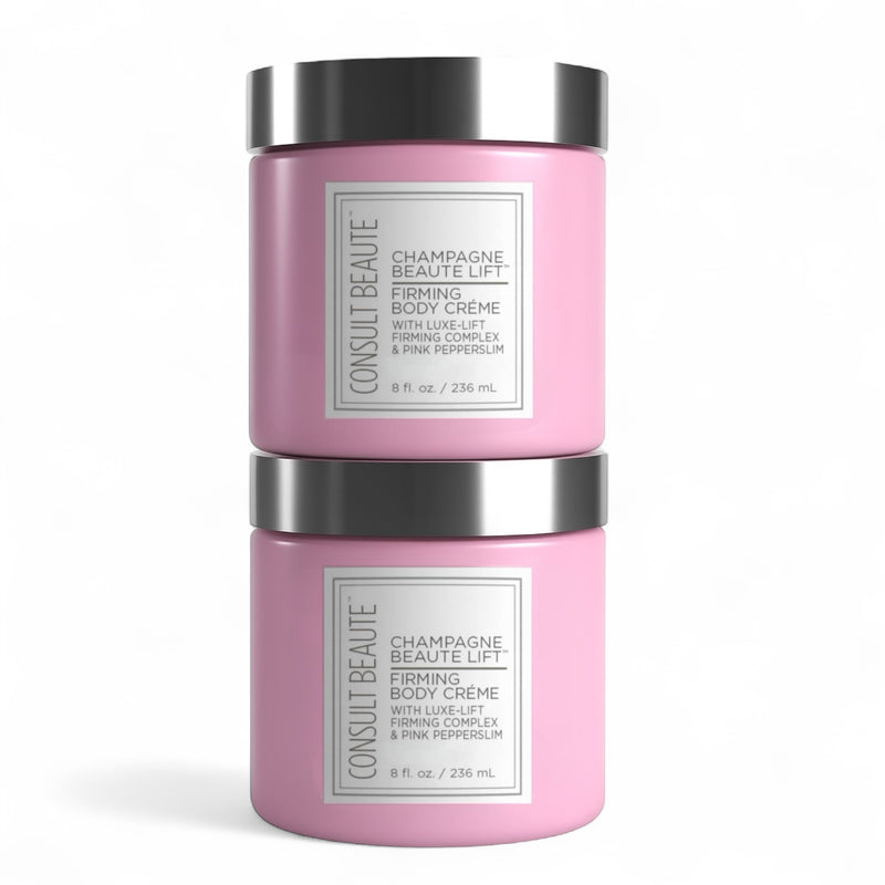 Two pink jars of Consult Beaute Firming Body Creme on a white background