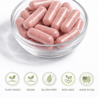 Pink capsules in a clear glass bowl with certification icons below on a white background.  Consult Health's Nature's Treasures Daily Food Supplements.  Mega Fruits.  Vegetables.  Consult by Dr Terry Dubrow and Heather Dubrow.  Plant Based.  Vegan.  Gluten-Free.  Non-GMO.  Made in the USA.  