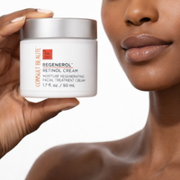 Person holding a jar of Regenerol Retinol Cream with a close-up of a woman's face.