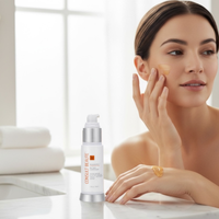 Woman applying cream to her face with a bottle of Consul Beaute product on a white surface.