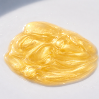 Gold-colored gel or cream on a white background